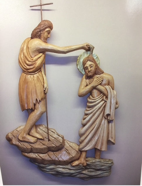Shallow relief carving of Christ being baptized