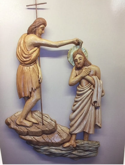 Shallow relief carving of Christ being baptized